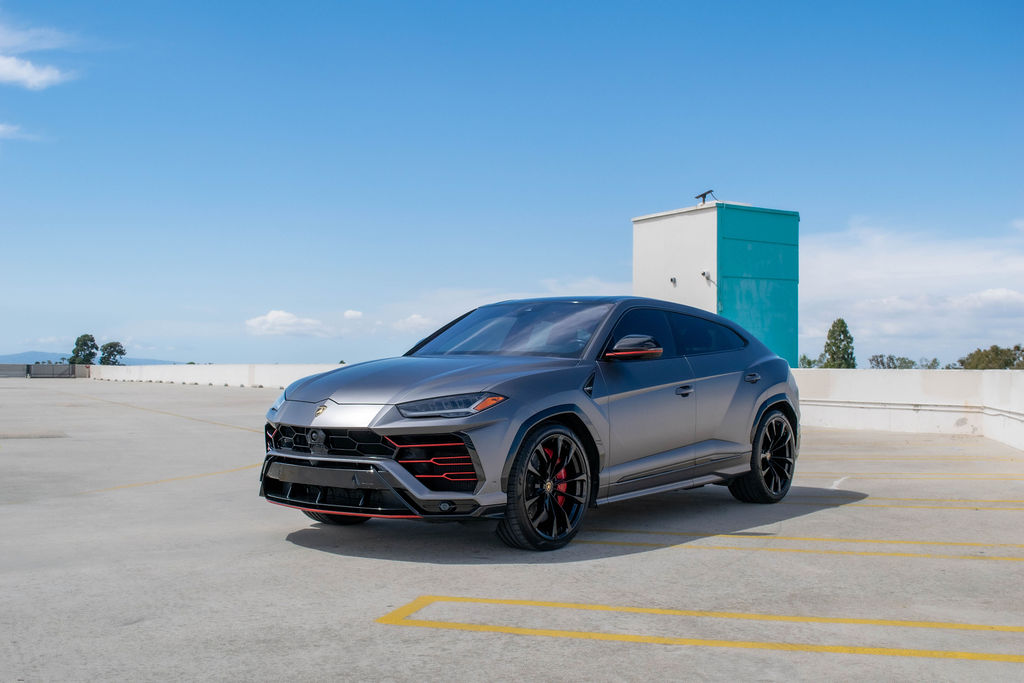 Grey Lamborghini Urus luxury SUV with Red interior