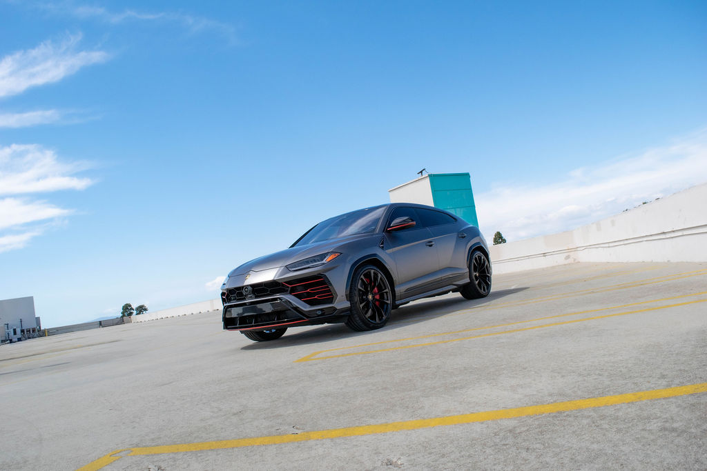Grey Lamborghini Urus AWD luxury SUV with Red interior