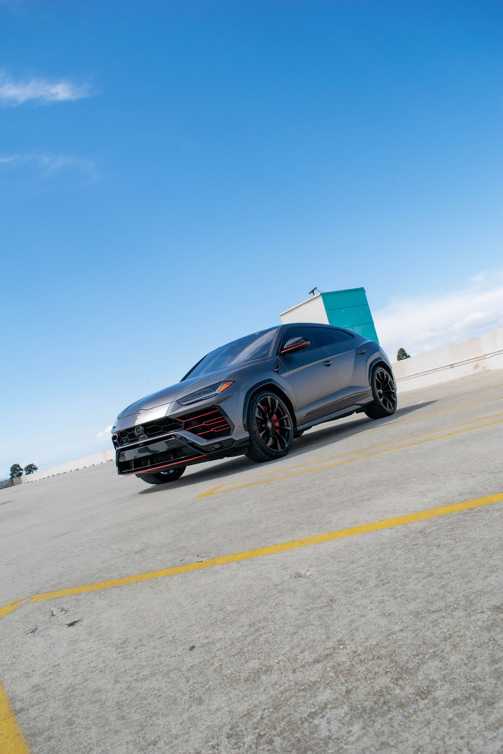 Grey Lamborghini Urus Red interior, luxury SUV rental in Orange County