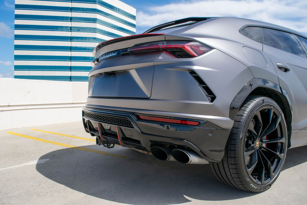 Grey Lamborghini Urus 5 seat luxury SUV with Red interior