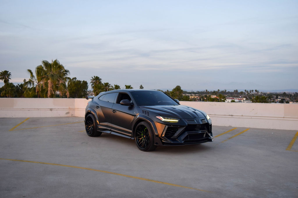 Satin Black Lamborghini Urus Mansory luxury SUV for rent in Orange County