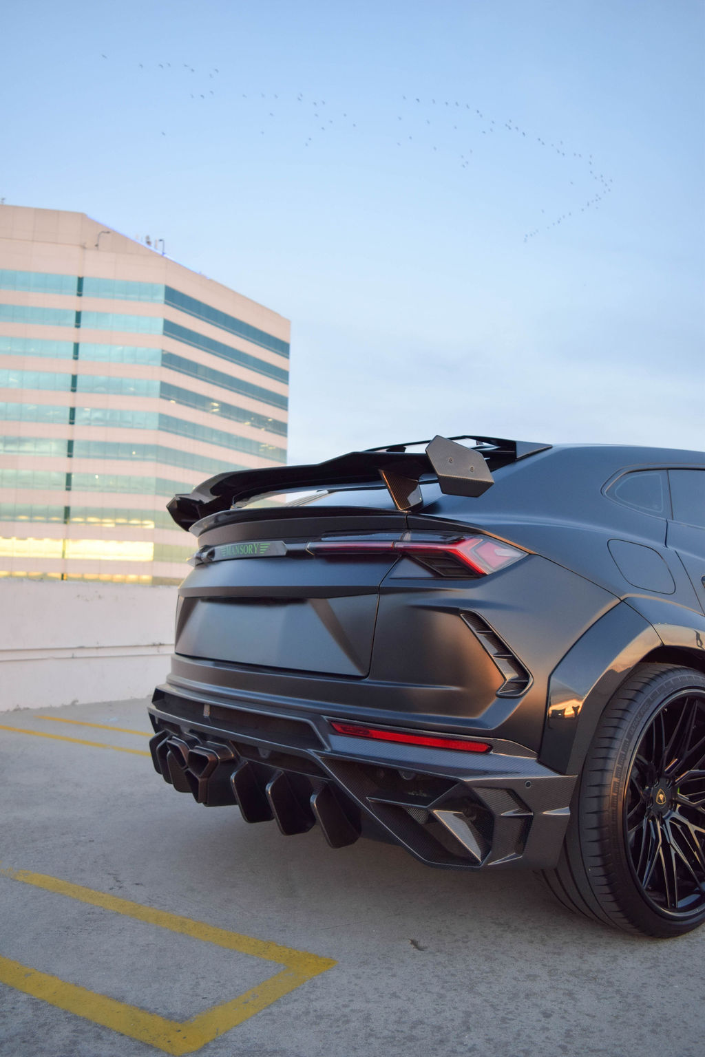 Satin Black Lamborghini Urus Mansory AWD luxury SUV rental in Orange County