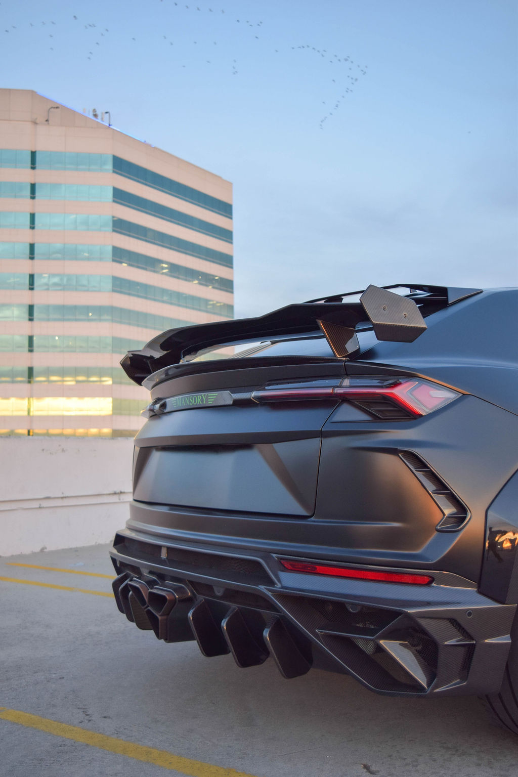Satin Black Lamborghini Urus Mansory luxury SUV with Green interior