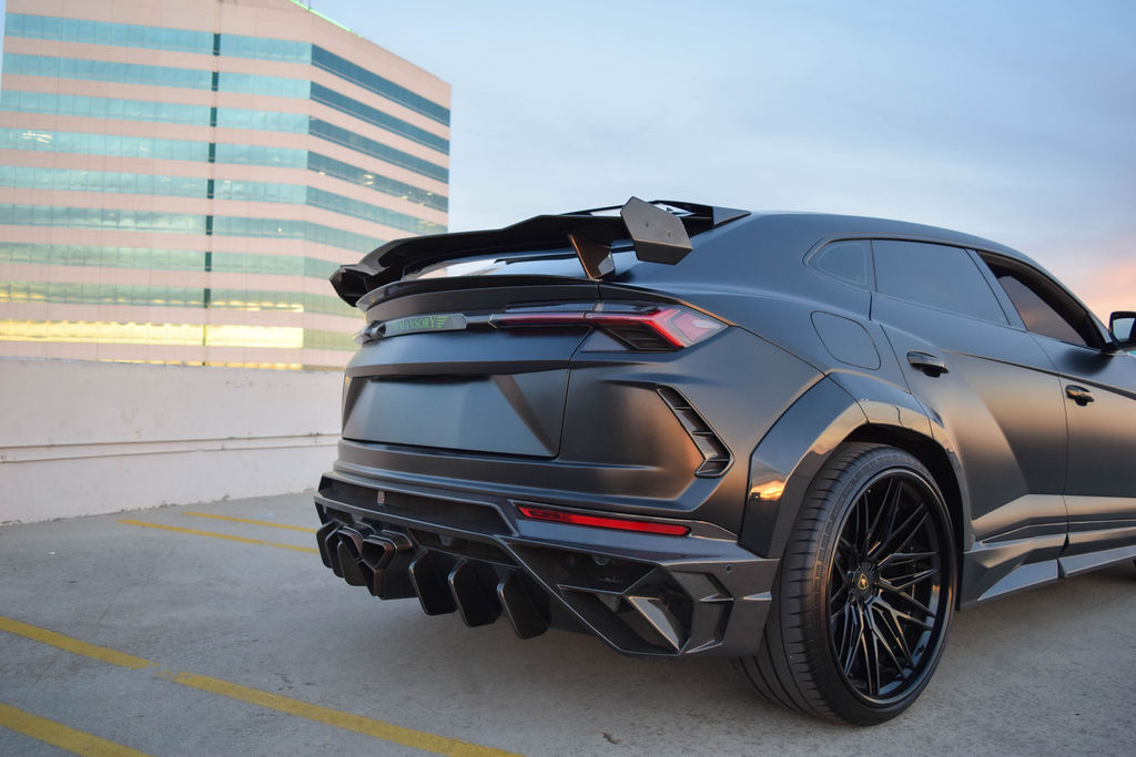 Satin Black Lamborghini Urus Mansory Green interior, luxury SUV rental in Orange County