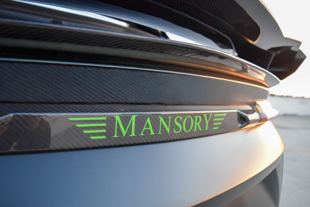 Satin Black Lamborghini Urus Mansory AWD luxury SUV available in Orange County