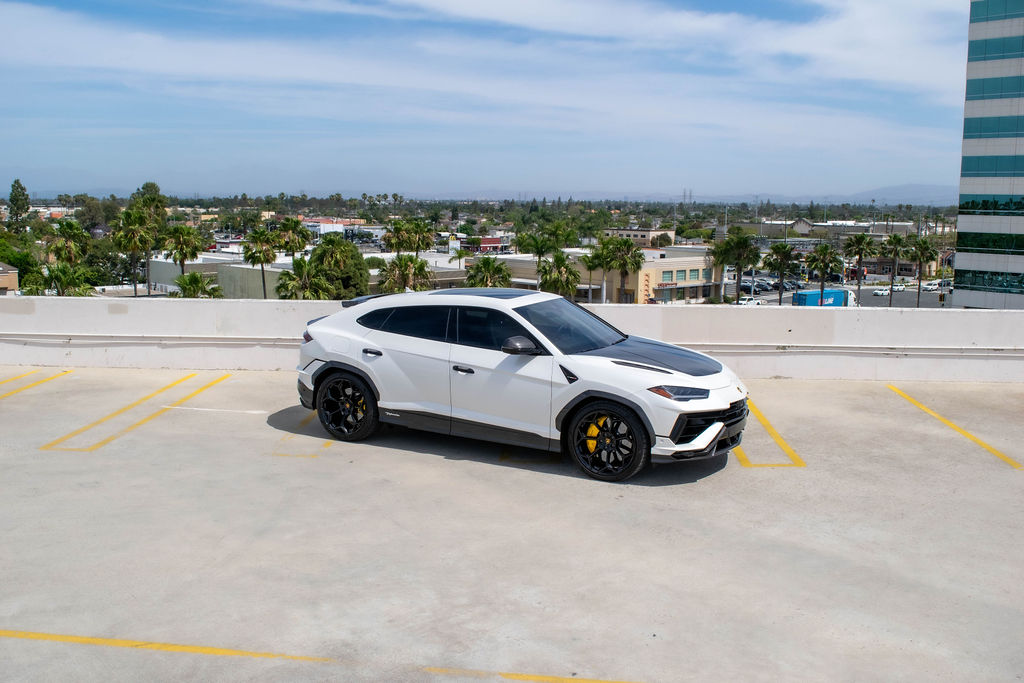White Lamborghini Urus Performante luxury SUV for hire in Orange County