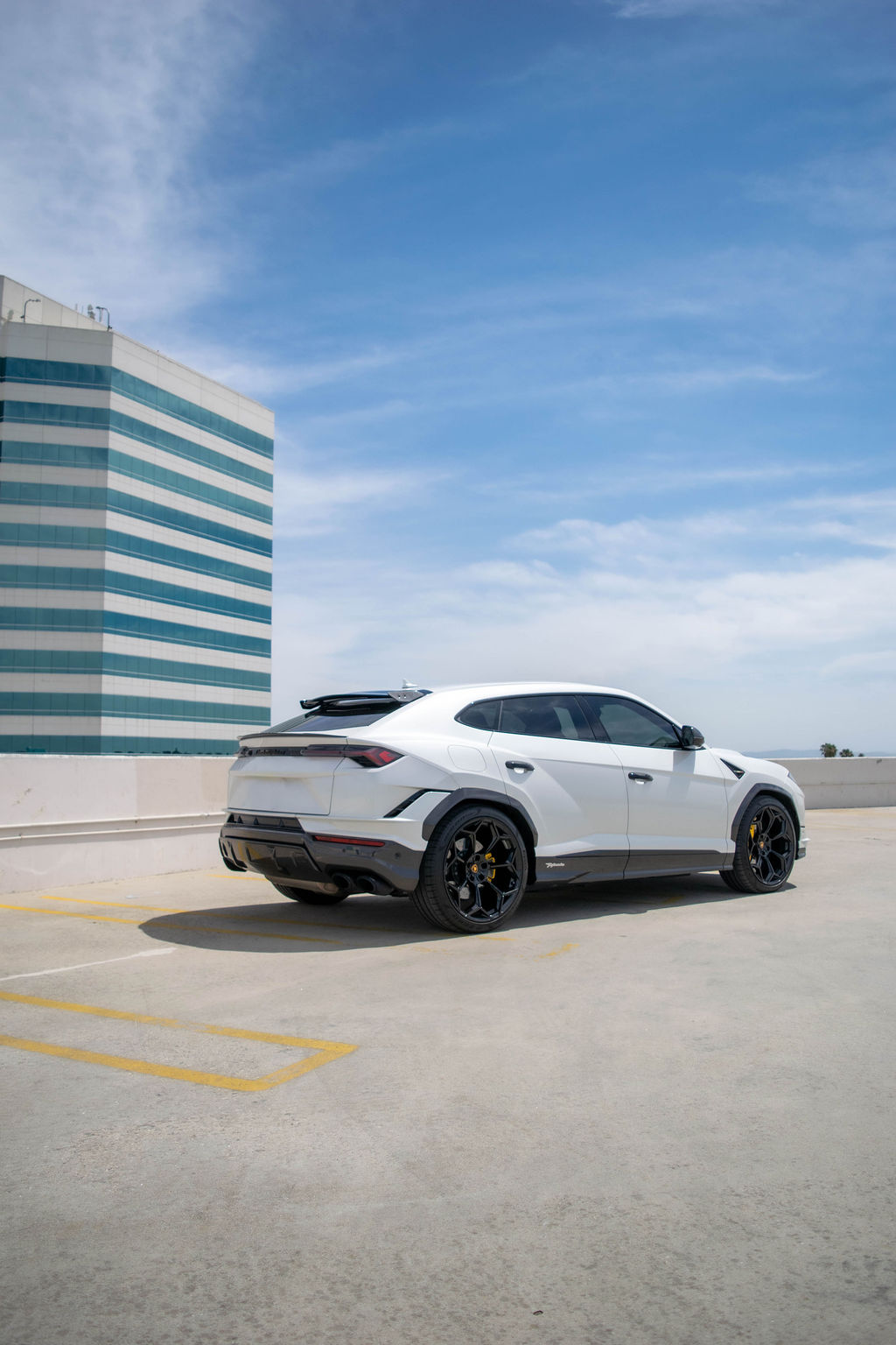 White Lamborghini Urus Performante luxury SUV available to rent in Orange County