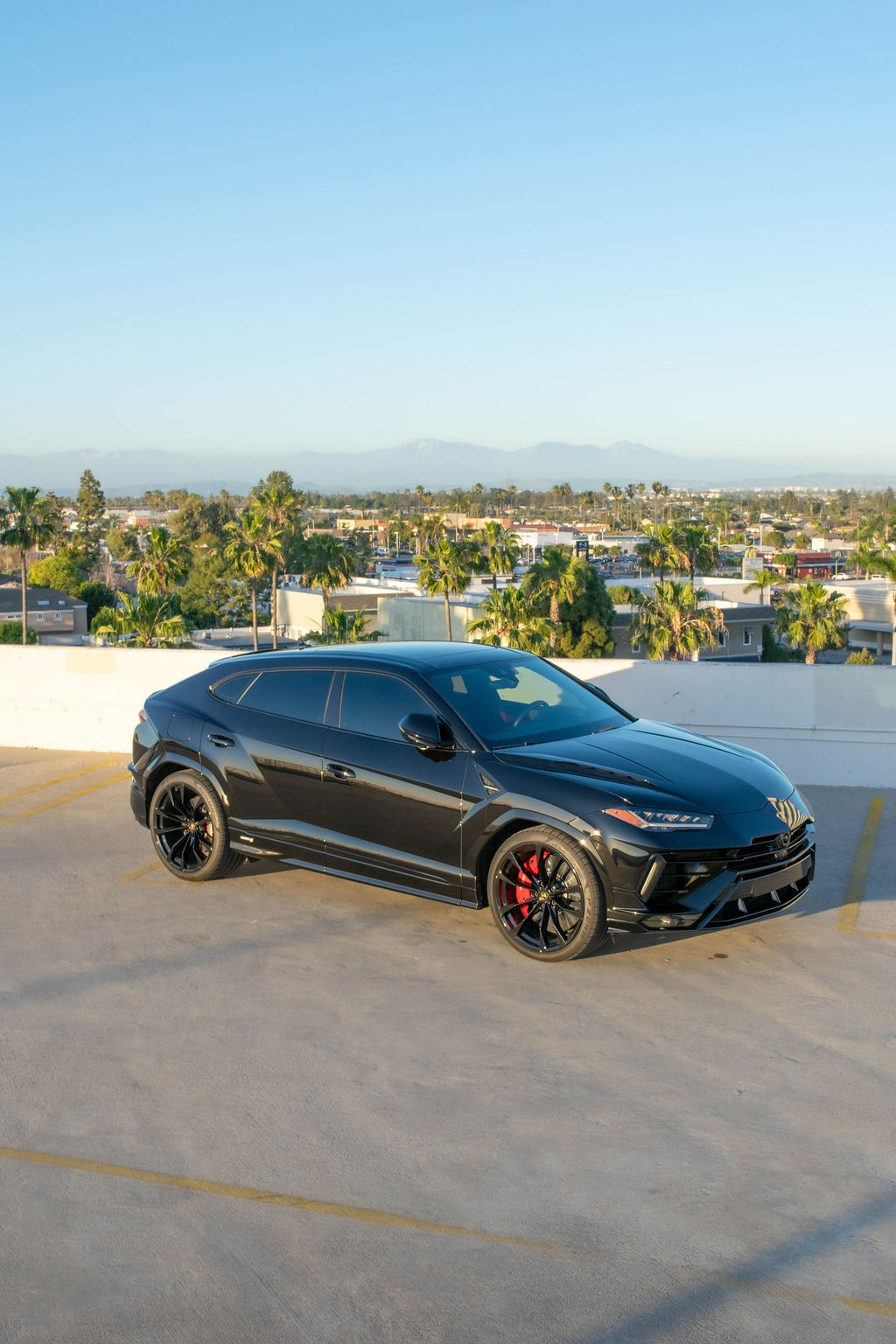 Black Lamborghini Urus S with Black and Red interior