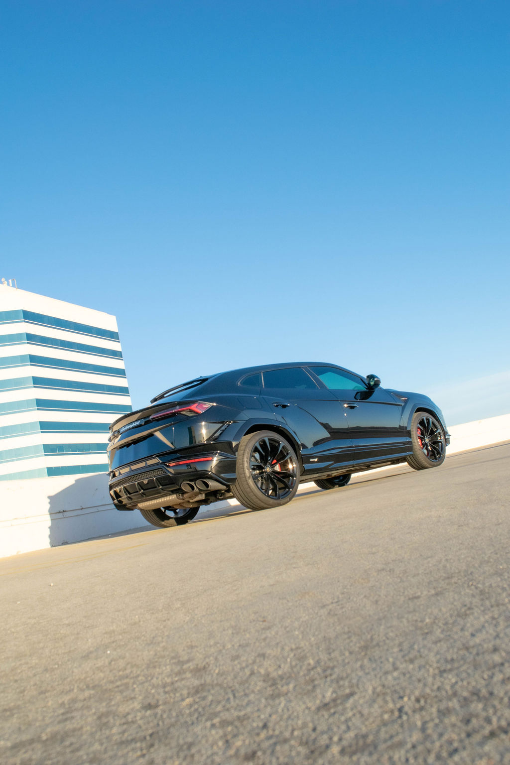 Black Lamborghini Urus S 5 seat luxury SUV rental in Orange County