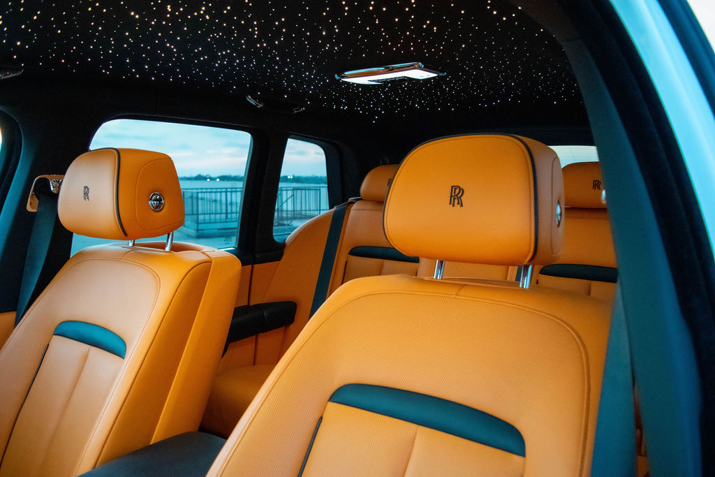White Rolls Royce Cullinan Black Badge, Luxury SUV rental, Orange interior