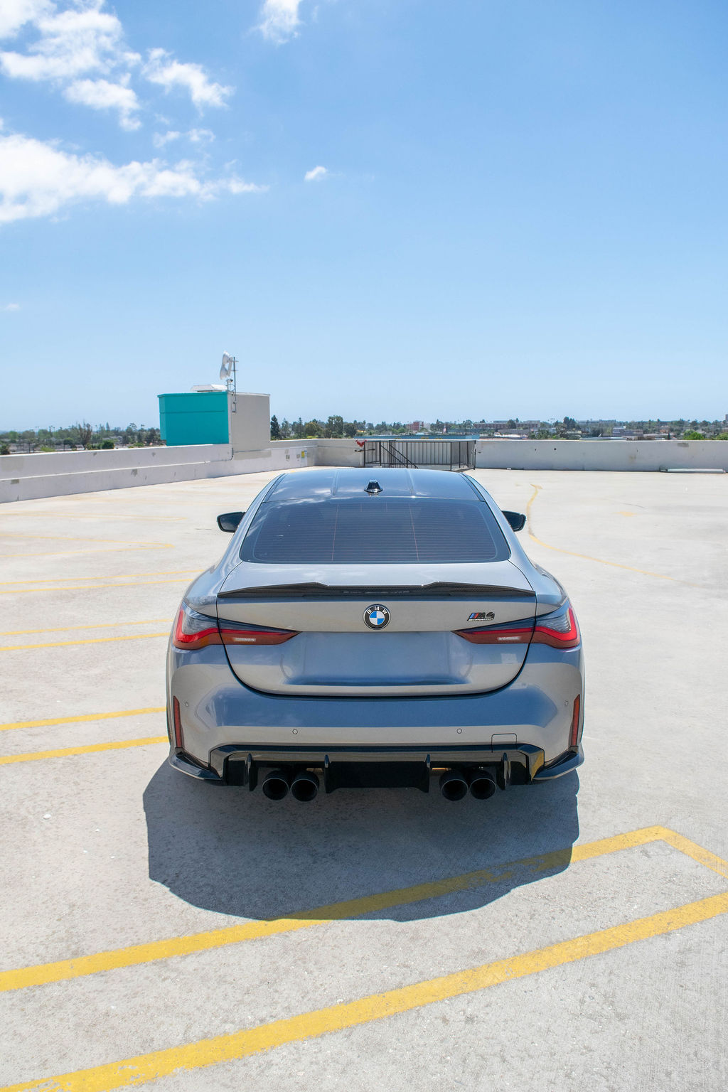 Grey BMW M4 Competition rental car, Black and White interior, Orange County, CA