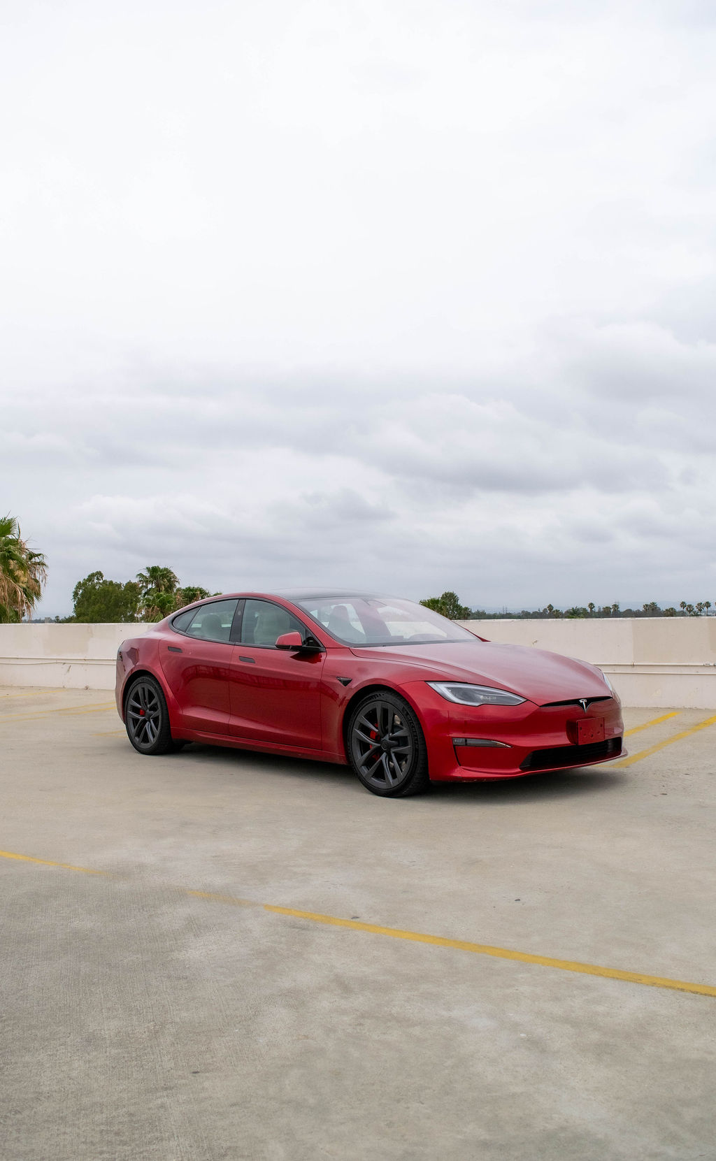 Red Tesla Model S Plaid, 5 seats, AWD