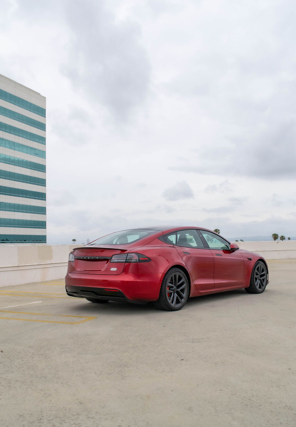 Red Tesla Model S Plaid, 4 doors, White interior