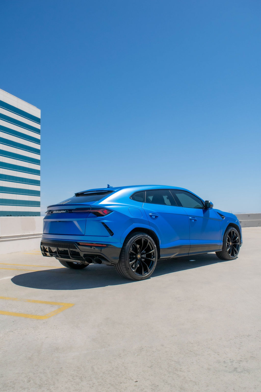 Blue Lamborghini Urus S AWD luxury SUV rental in Orange County