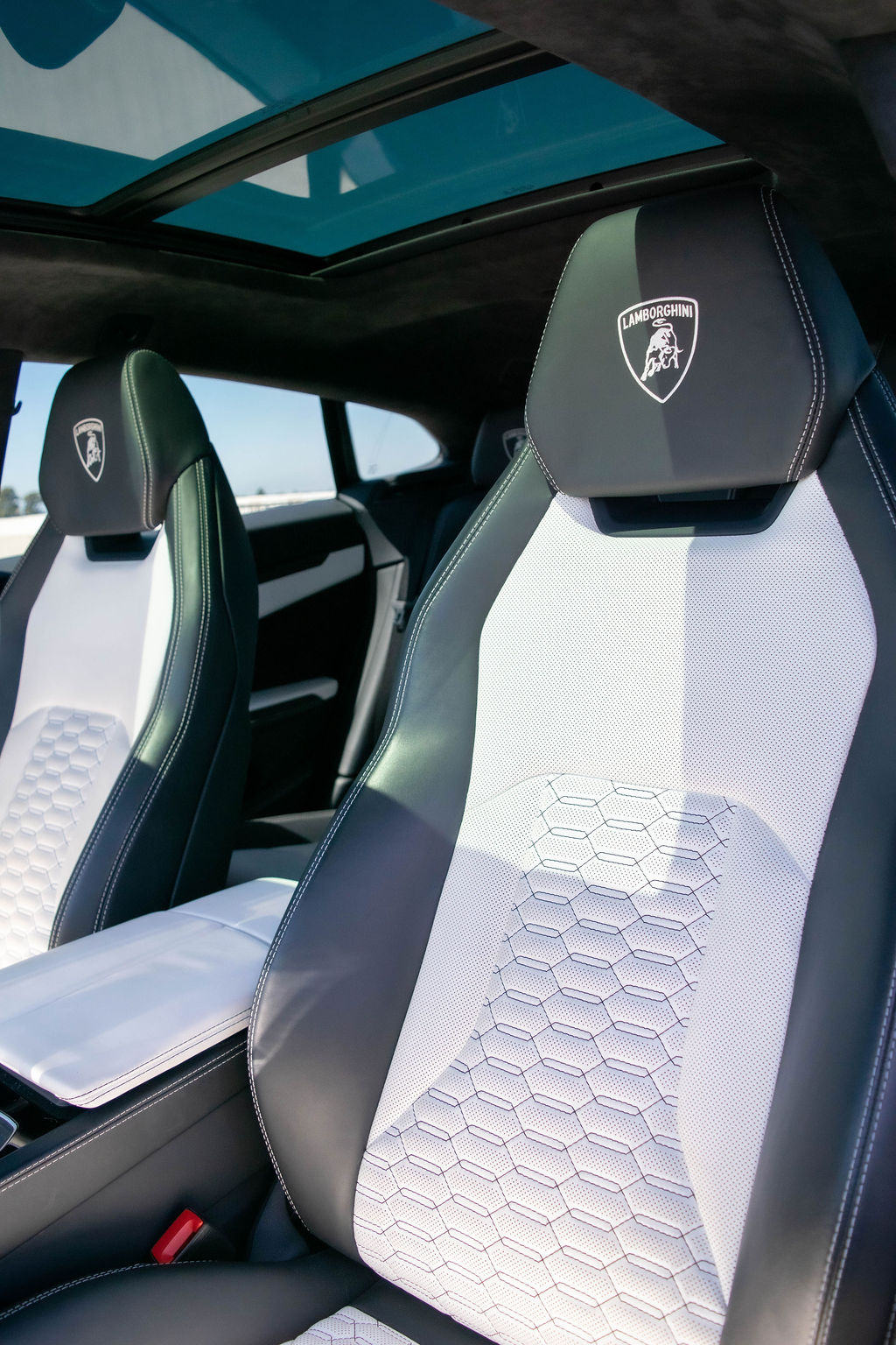 Blue Lamborghini Urus S with White interior