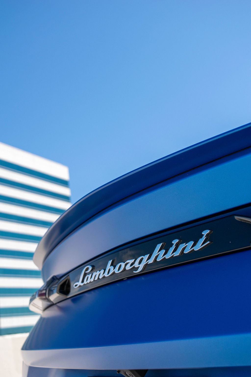 Blue Lamborghini Urus S AWD luxury SUV with White interior