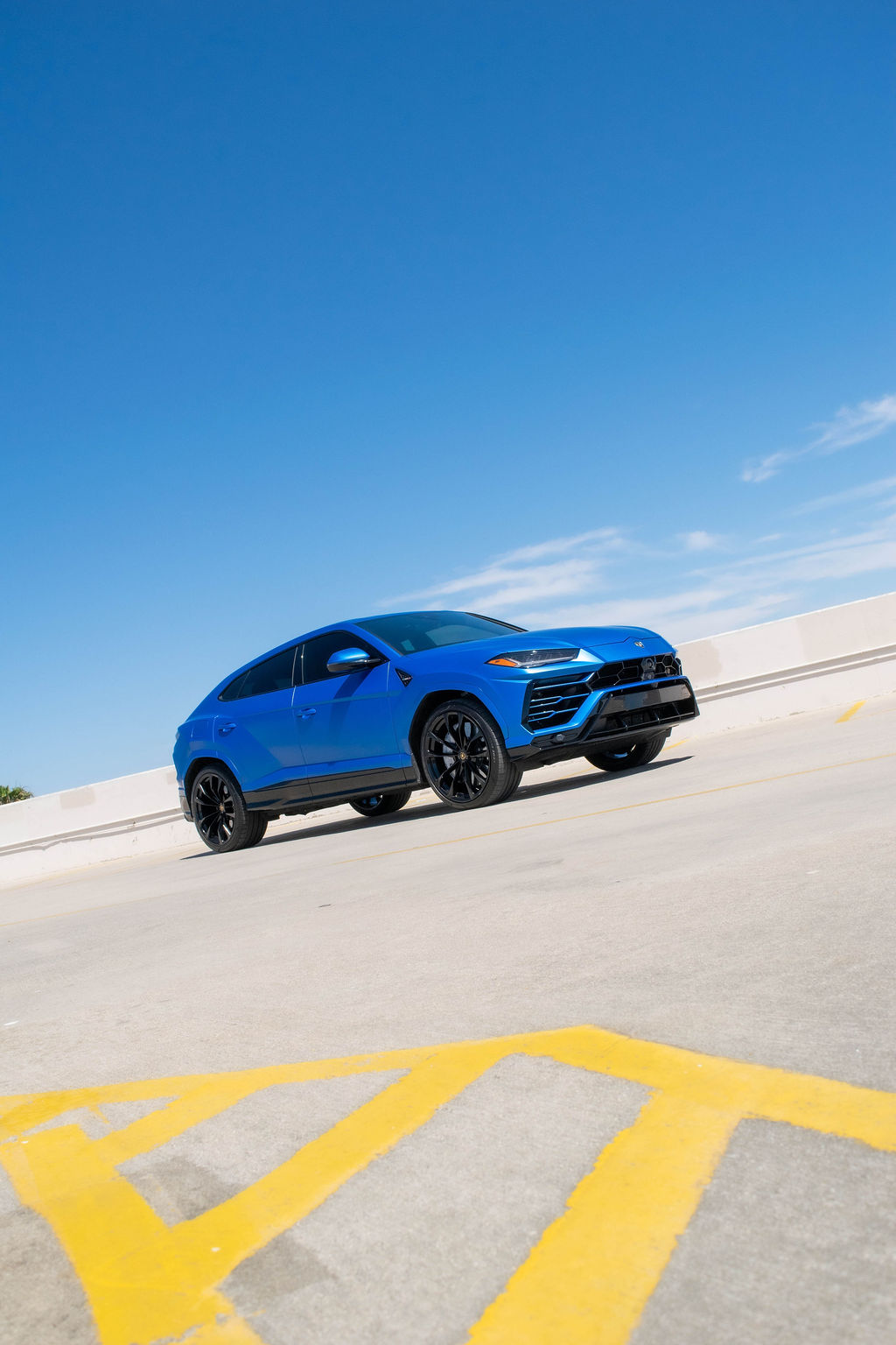 Blue Lamborghini Urus S luxury SUV rental delivered in Orange County