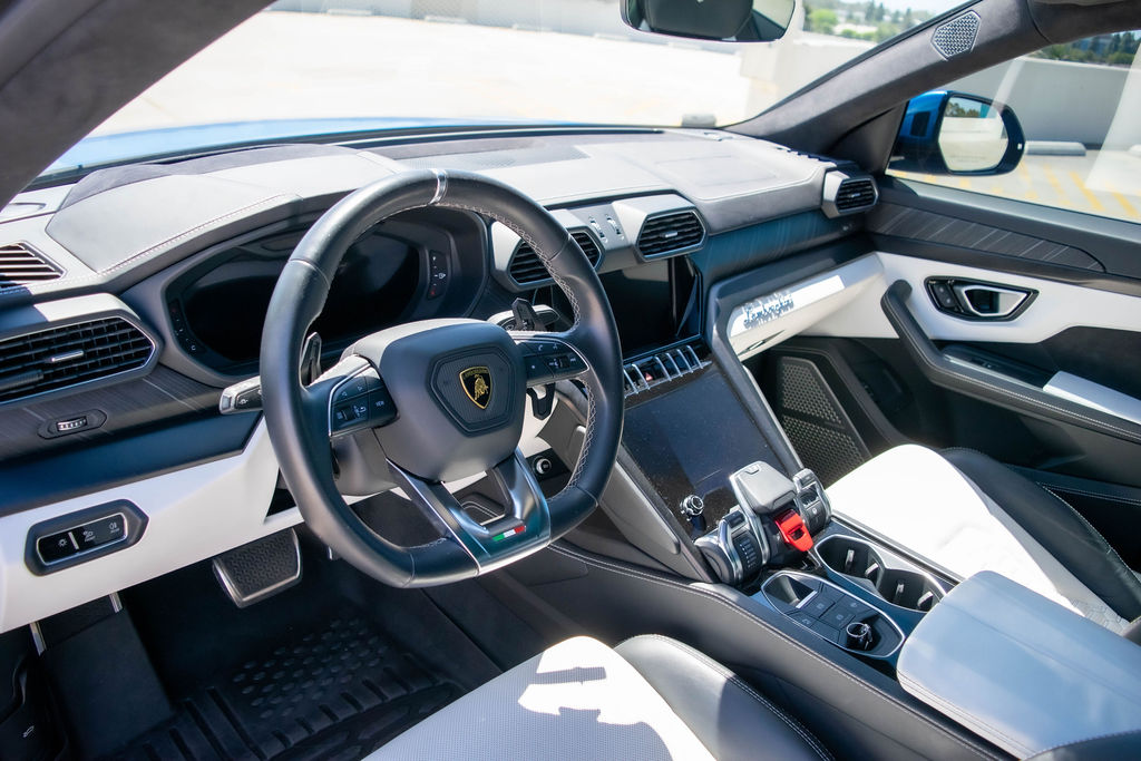 Blue Lamborghini Urus S White interior, luxury SUV rental in Orange County