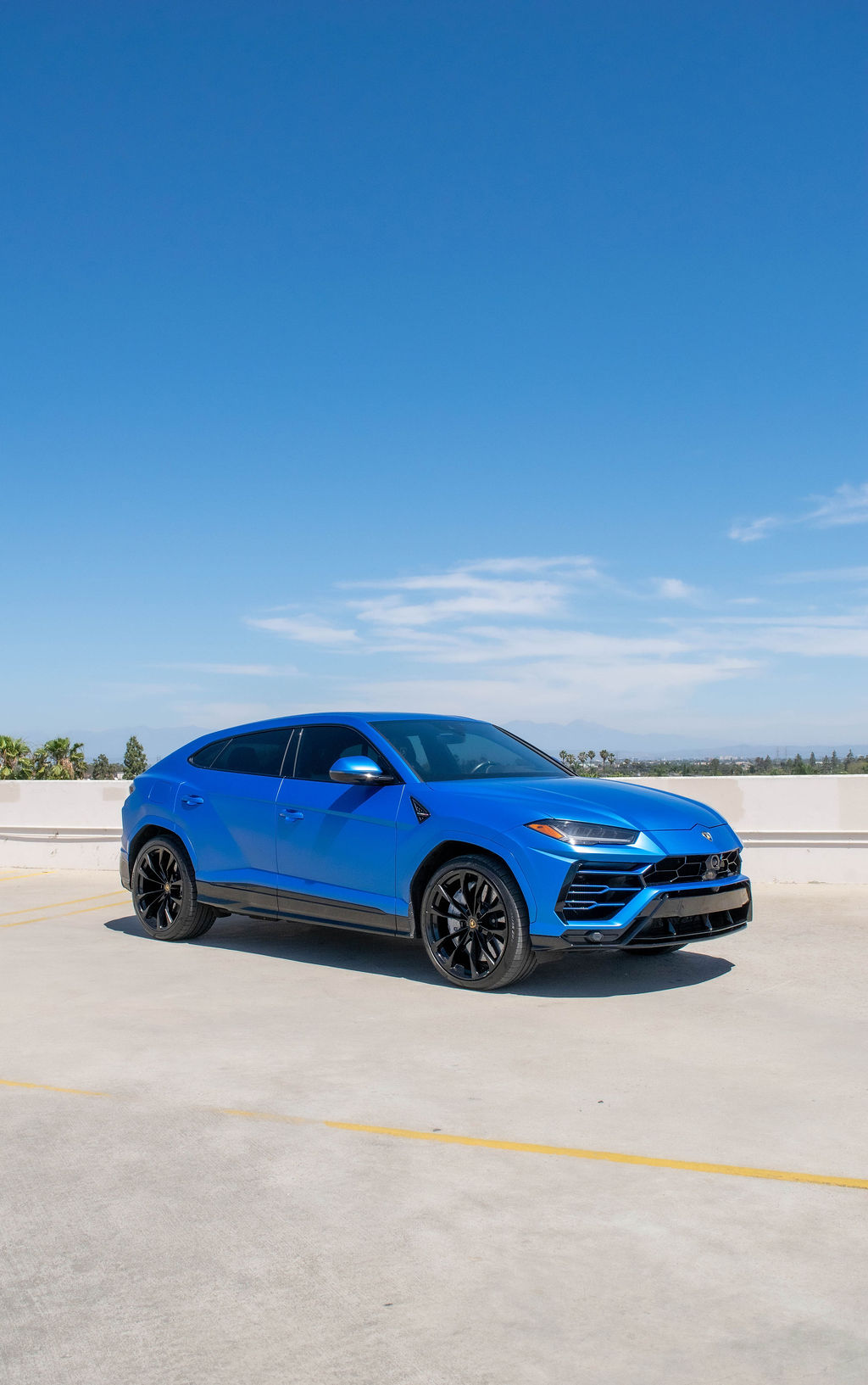 Blue Lamborghini Urus S AWD 5 seat luxury SUV