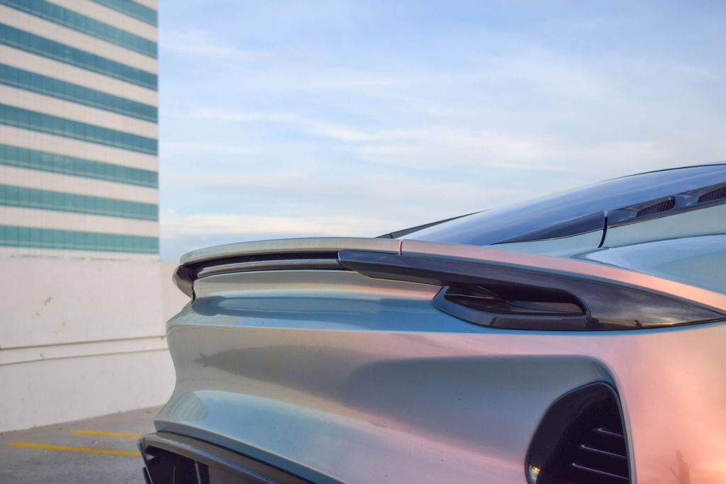 Multi-Color Lotus Emira V4 sports car with Black interior
