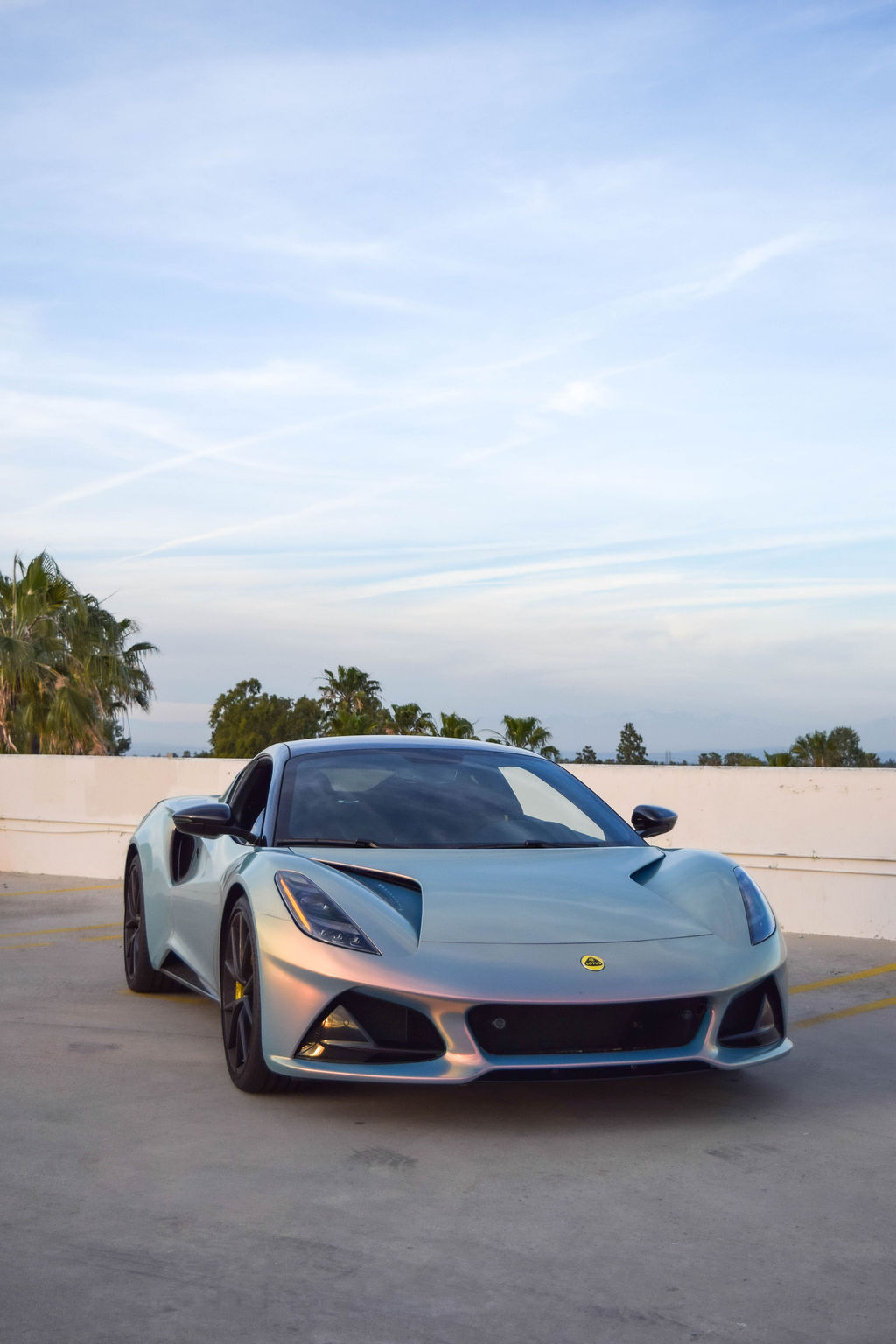Multi-Color Lotus Emira V4 sports car rental in Orange County with Black interior