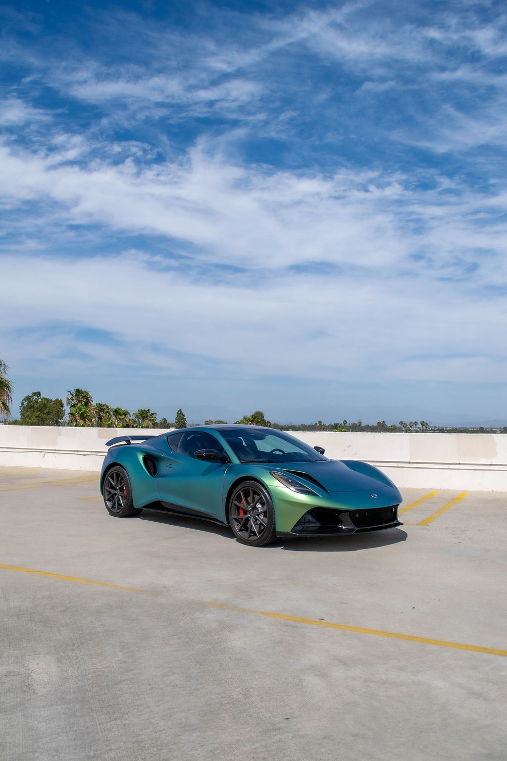 Green Lotus Emira V6 sports car rental delivered in Orange County