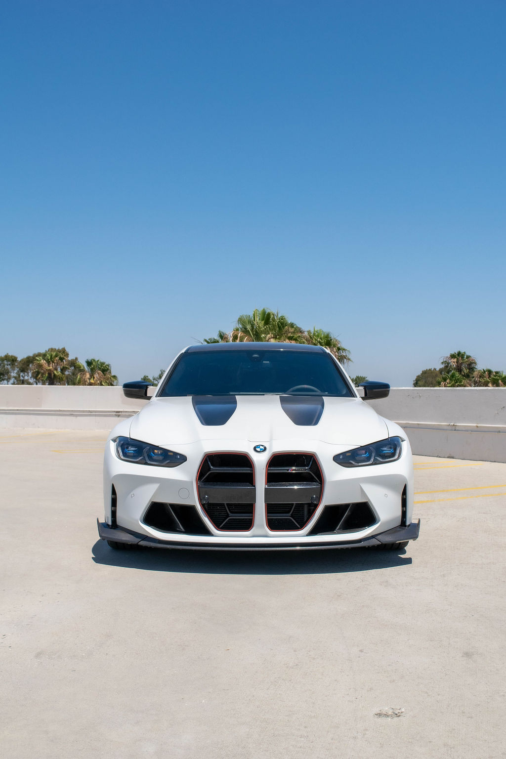 White BMW M3 CS sports car rental in Orange County with Black and Red interior