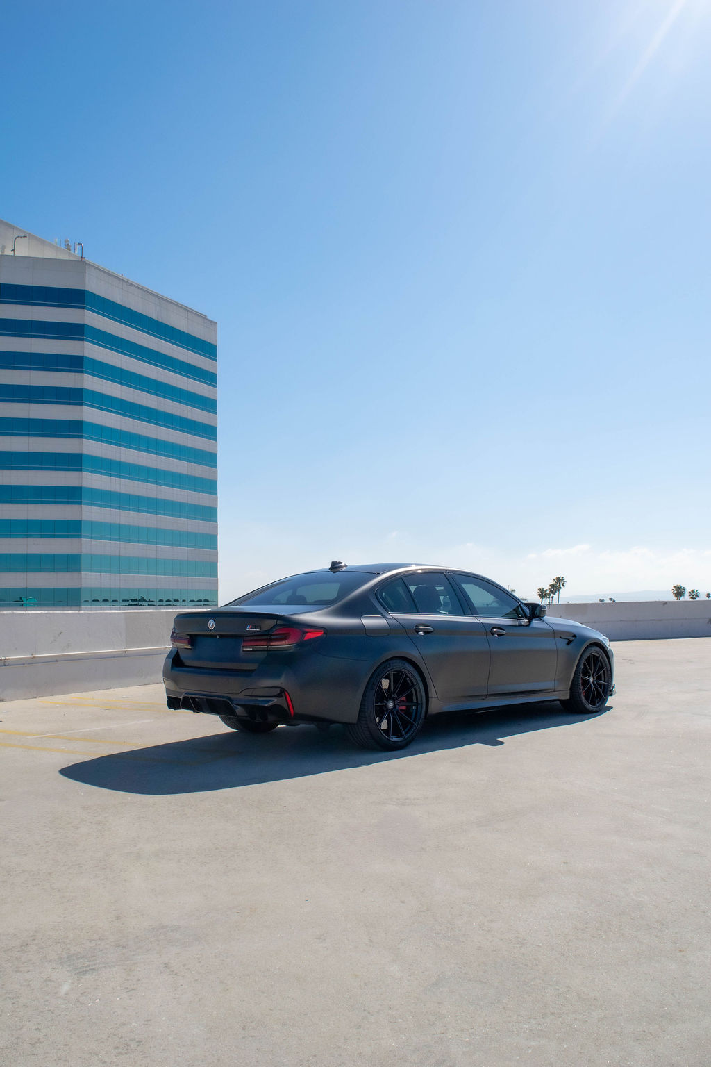 Black BMW M5 Competition sports car with 5 seat cabin, Orange County rental