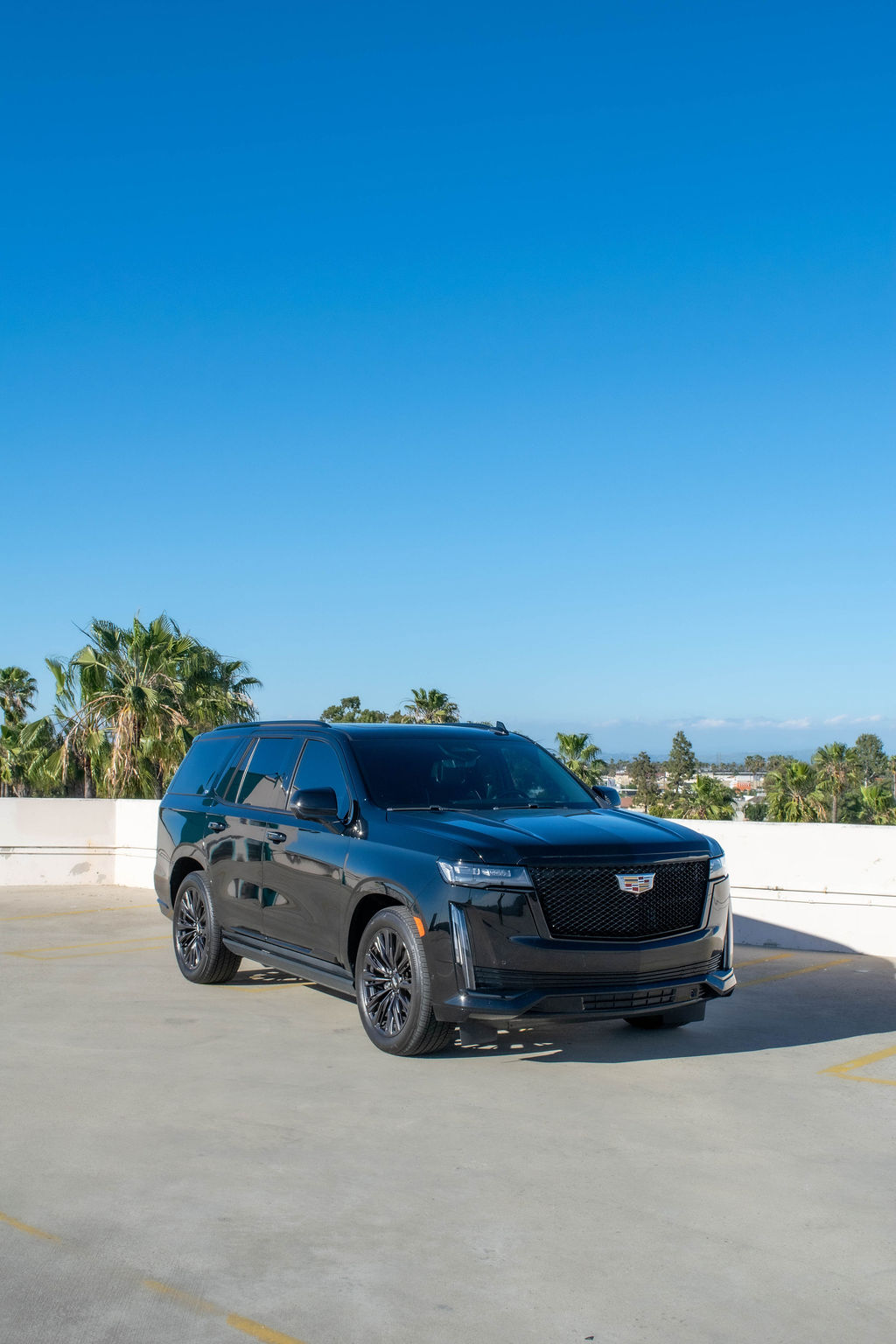 Black Cadillac Escalade ESV Sport with RWD drivetrain, luxury SUV rental in Orange County