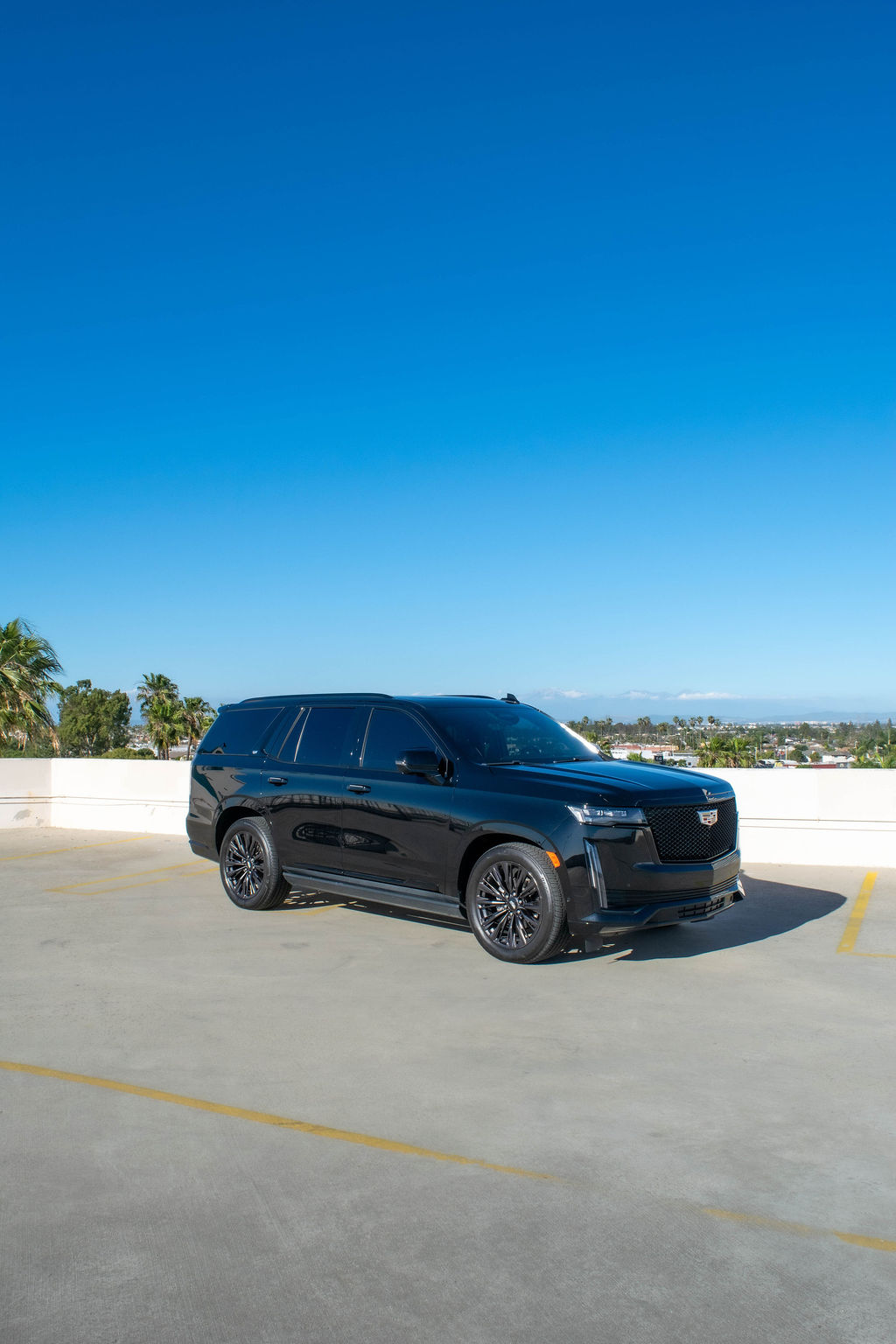 Black Cadillac Escalade ESV Sport, a 4 door luxury SUV for hire in Orange County