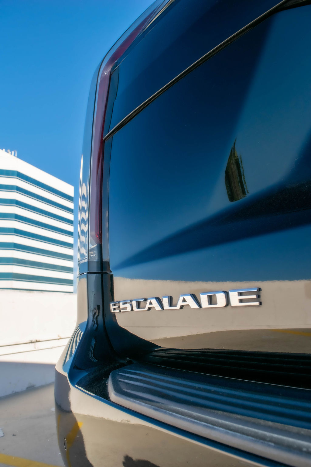 Black Cadillac Escalade ESV Sport with Black interior for hire across Orange County, CA