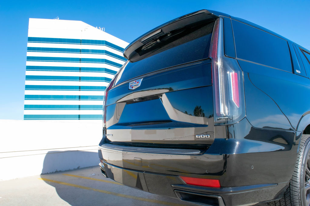 Black Cadillac Escalade ESV Sport luxury SUV rental in Orange County, RWD
