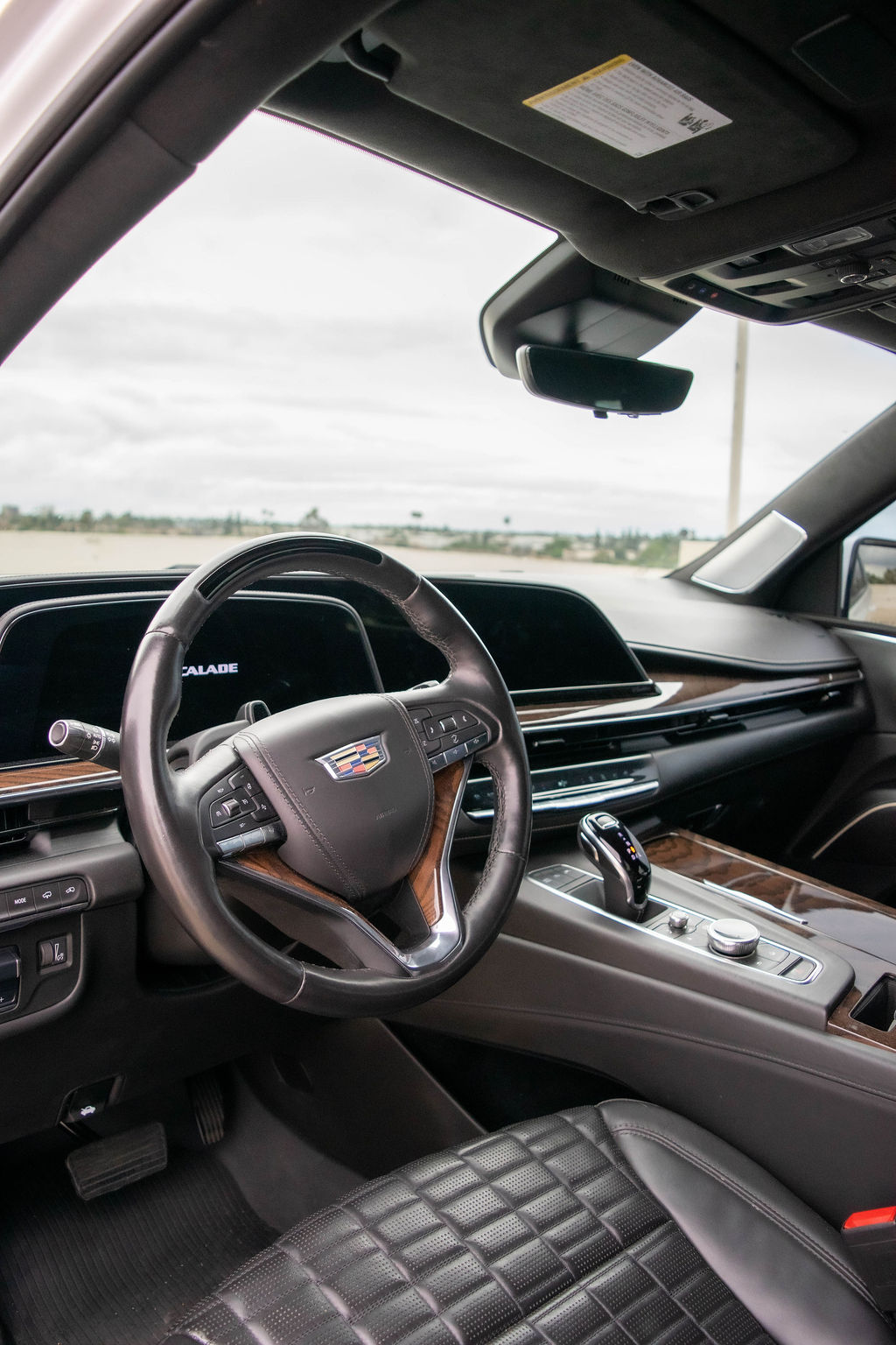White Cadillac Escalade ESV Sport Platinum luxury SUV available to rent across Orange County, CA