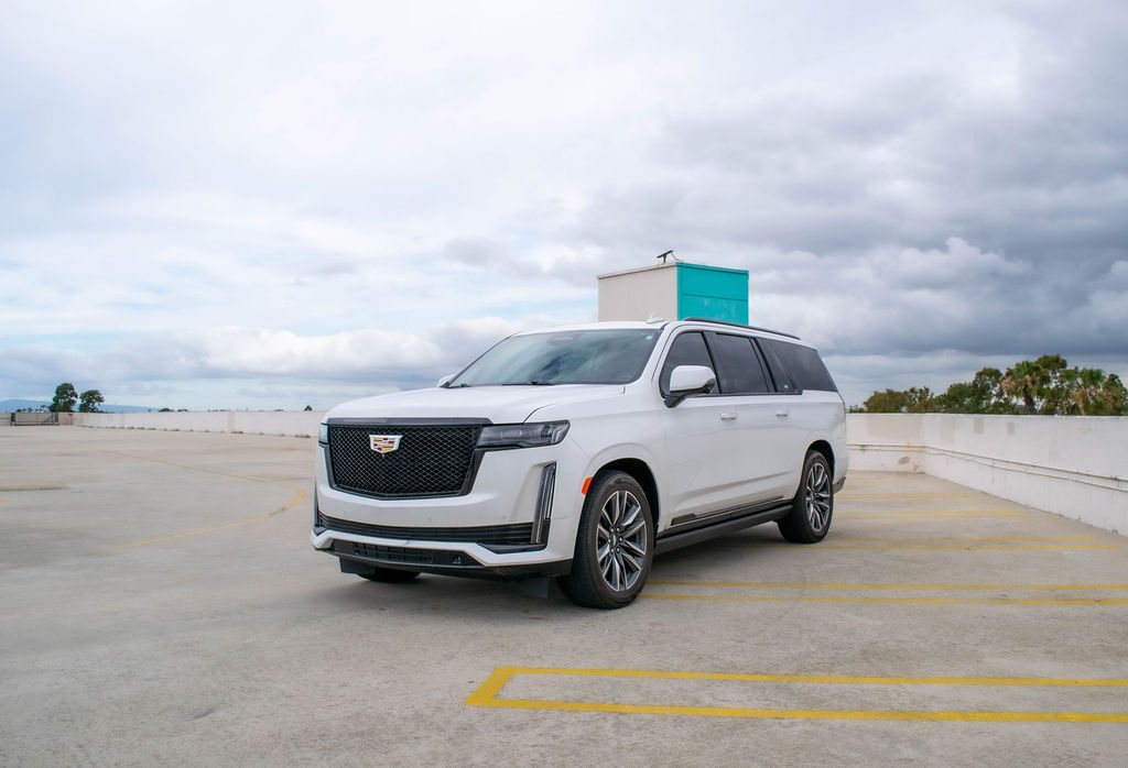 White Cadillac Escalade ESV Sport Platinum with RWD drivetrain, luxury SUV rental in Orange County