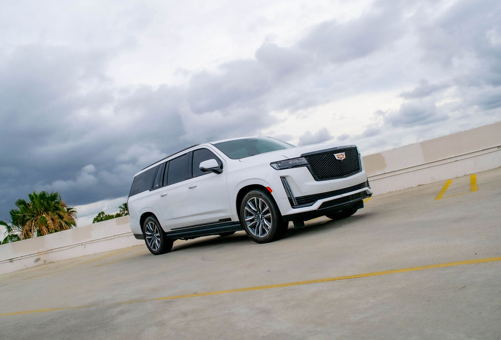 White Cadillac Escalade ESV Sport Platinum, a 4 door luxury SUV for hire in Orange County