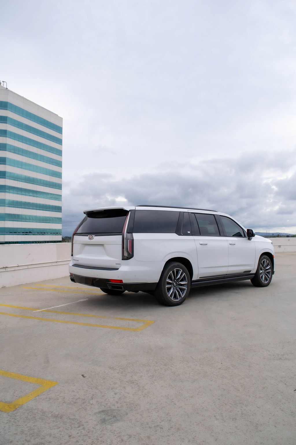 White Cadillac Escalade ESV Sport Platinum luxury SUV with 7 seat cabin, Orange County rental