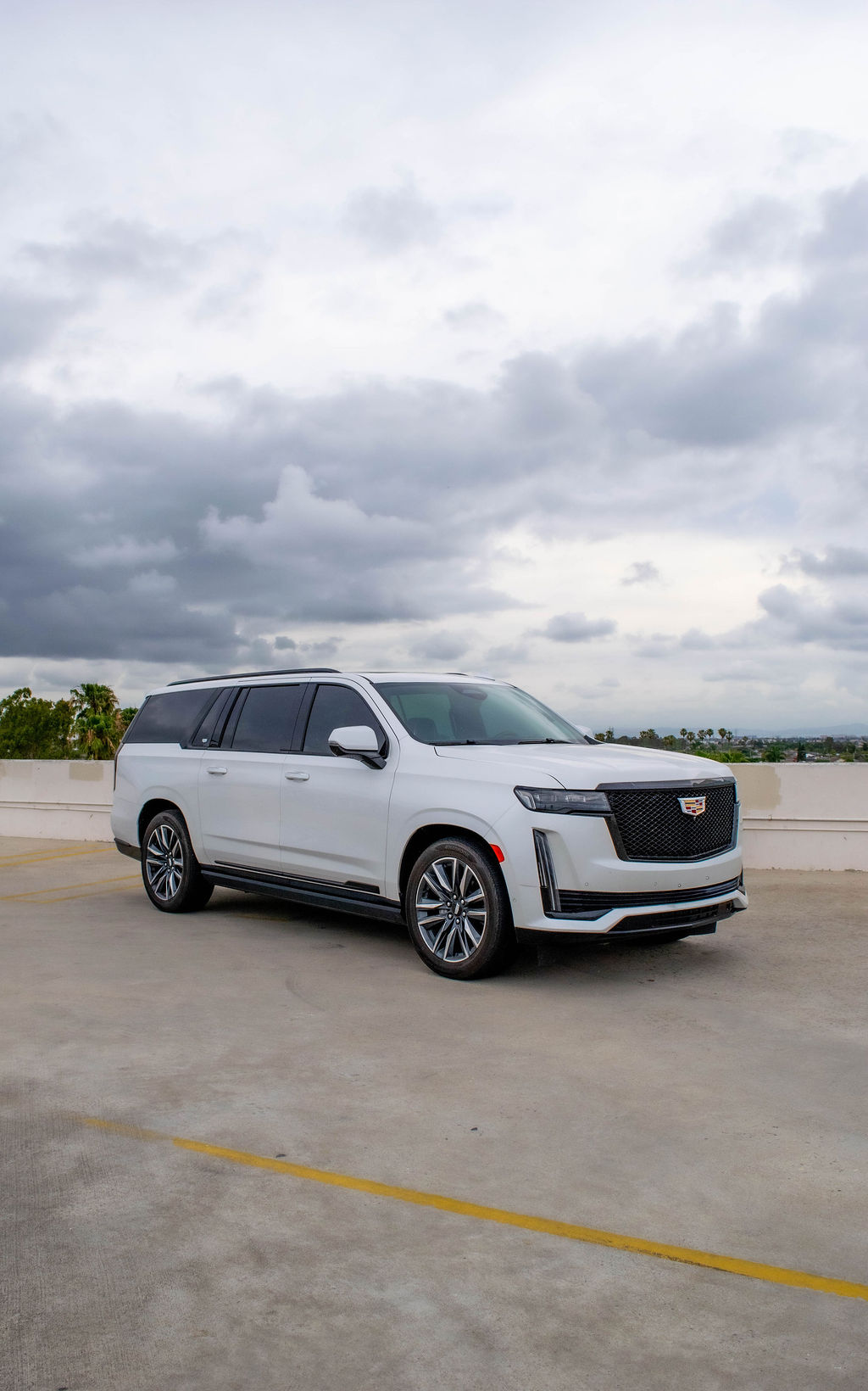 White Cadillac Escalade ESV Sport Platinum luxury SUV for rent, 7 seats, Orange County