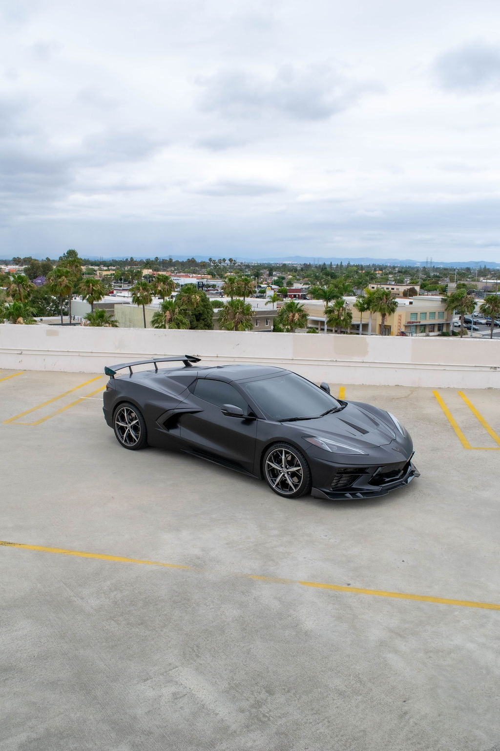 Black Chevrolet Corvette C8 Stingray with RWD drivetrain, sports car rental in Orange County