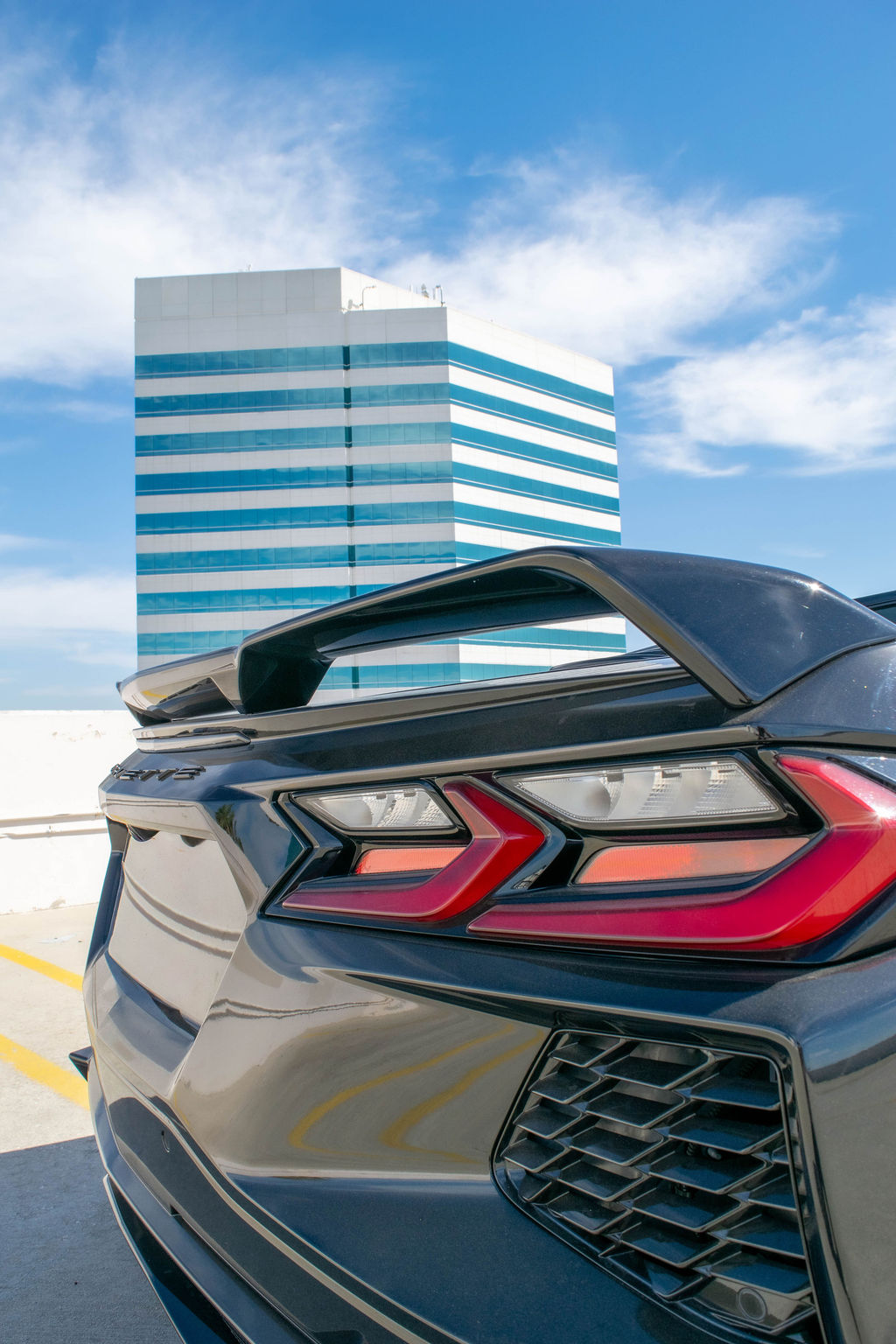 Black Chevrolet Corvette C8 Stingray sports car available to rent across Orange County, CA, Black and Red interior