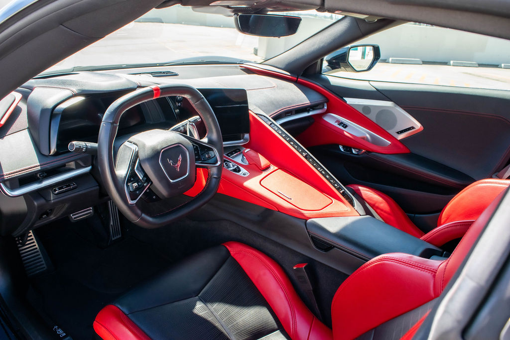 Black Chevrolet Corvette C8 Stingray, a 2 door sports car for hire in Orange County, Black and Red interior