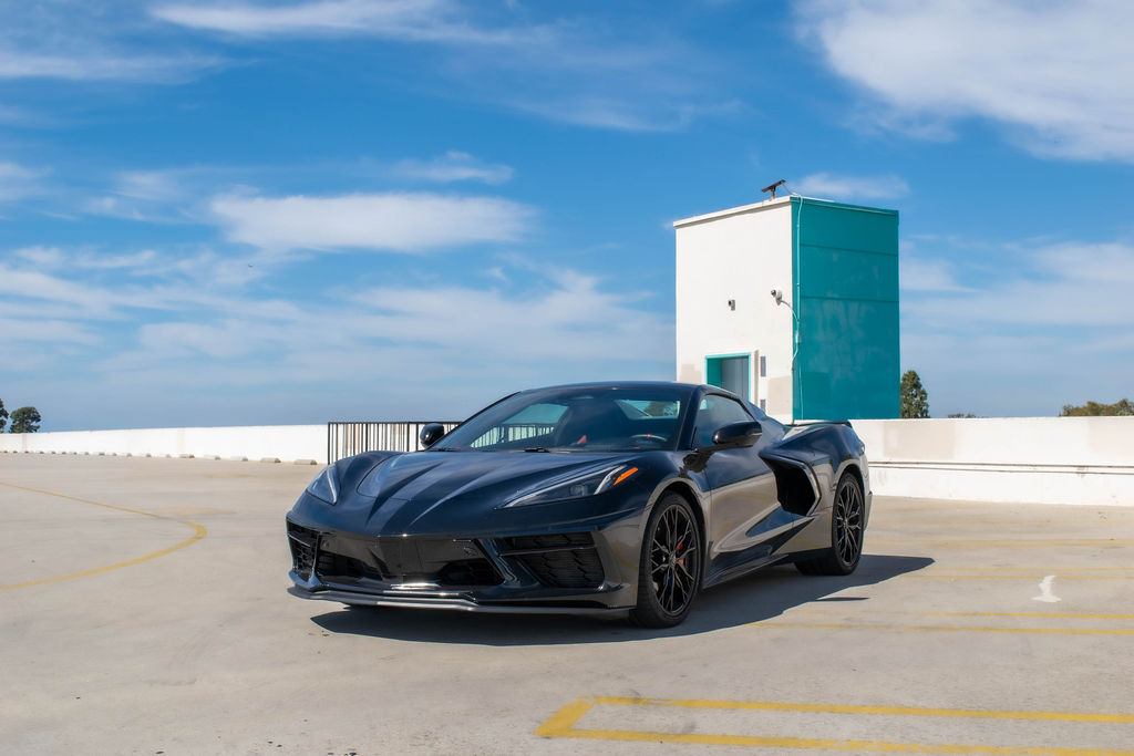 Black Chevrolet Corvette C8 Stingray RWD sports car, exotic rental in Orange County, Black and Red interior