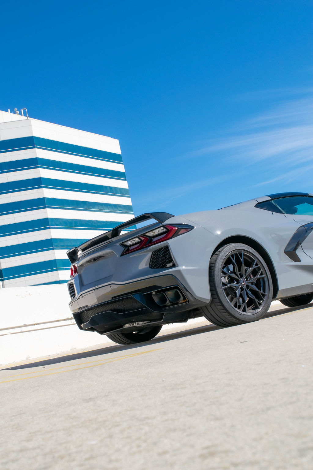 Grey Chevrolet Corvette C8 Stingray with RWD drivetrain, sports car rental in Orange County