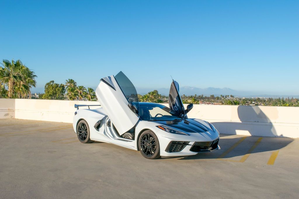 White Chevrolet Corvette C8 Stingray RWD sports car, exotic rental in Orange County