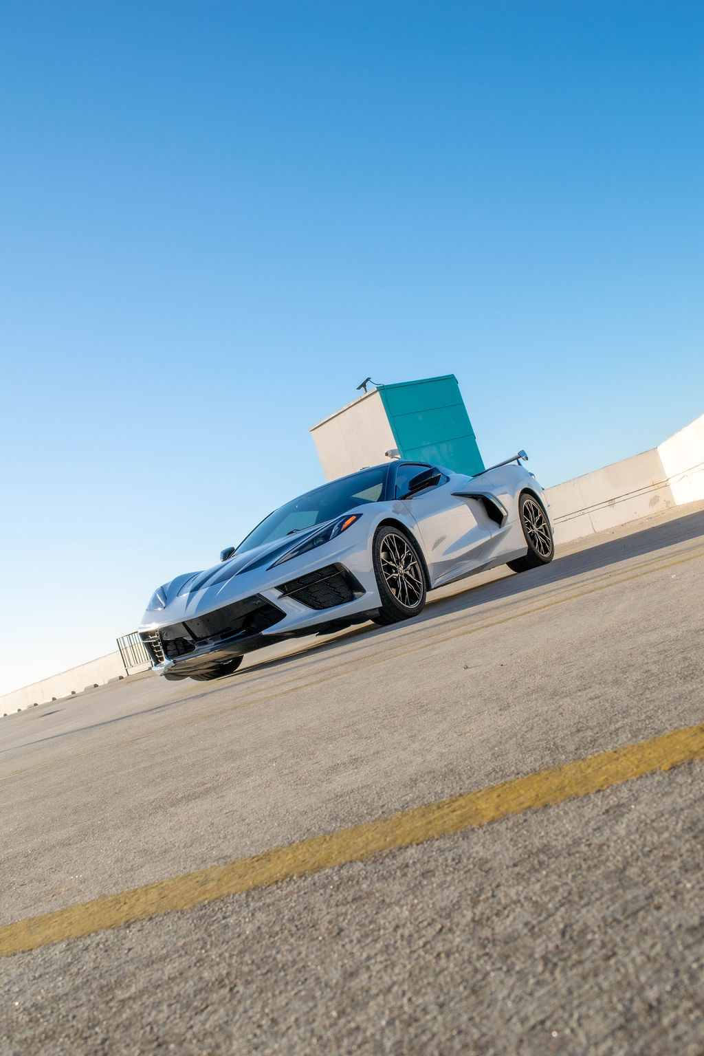 White Chevrolet Corvette C8 Stingray sports car, RWD, rental in Orange County, CA