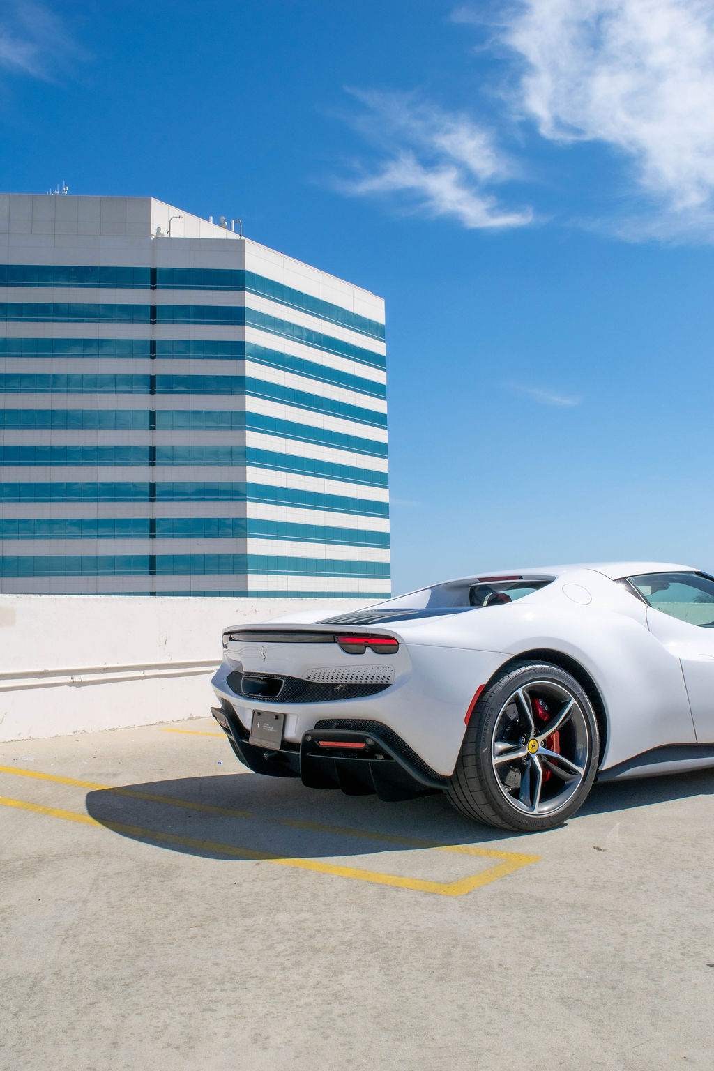 White Ferrari 296 GTB supercar rental delivered across Orange County, CA