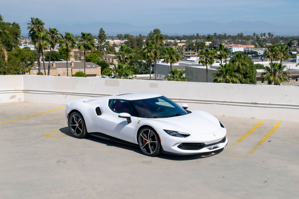 White Ferrari 296 GTB, 2 door supercar with Red interior