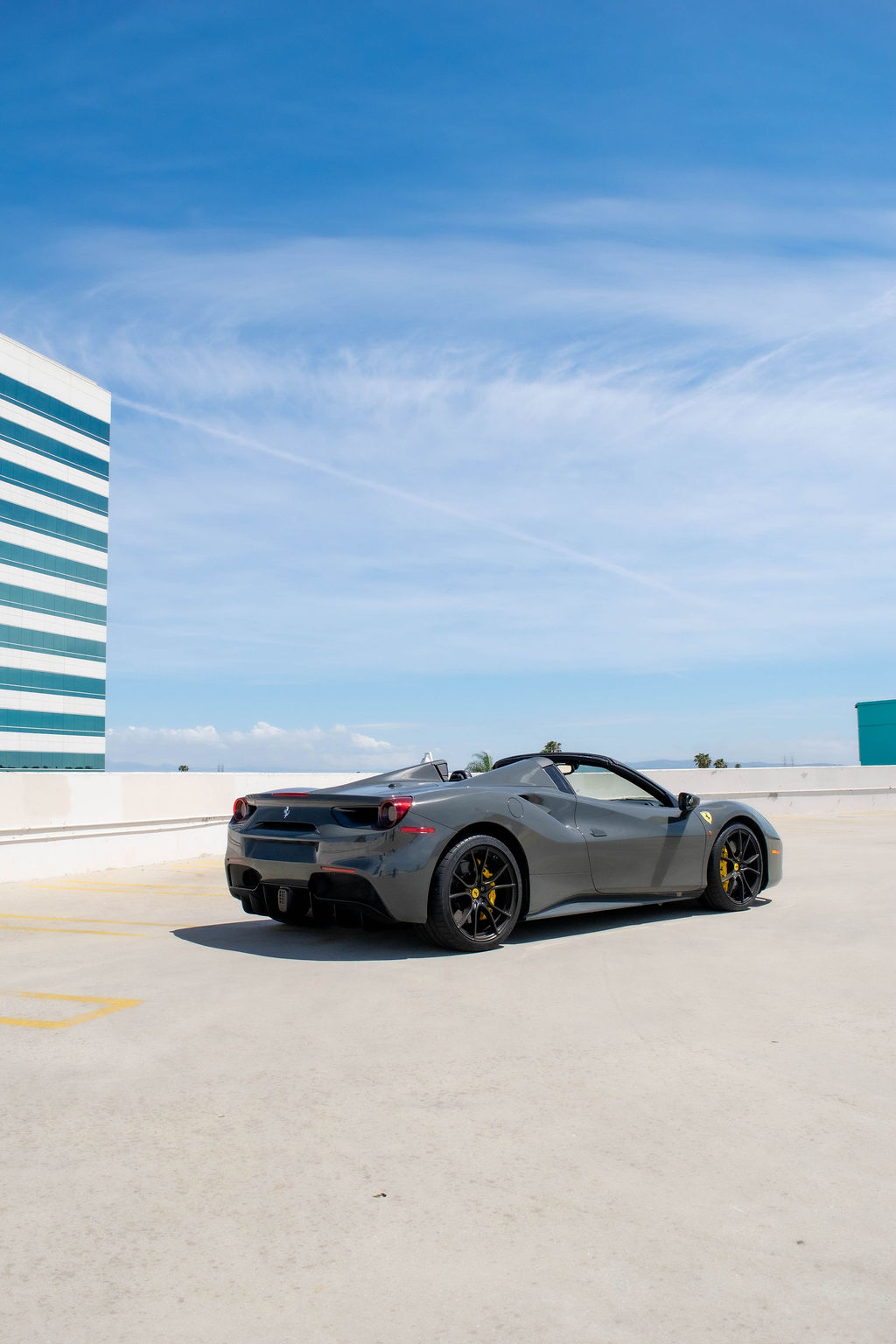 Grey Ferrari 488 Spider supercar available to rent across Orange County, CA