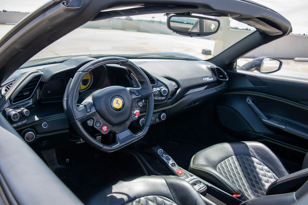 Grey Ferrari 488 Spider with RWD drivetrain, supercar rental in Orange County
