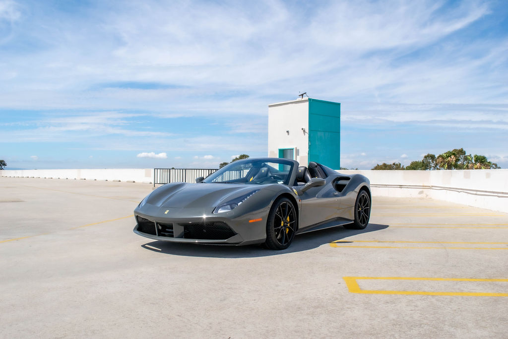 Grey Ferrari 488 Spider supercar, Black and Yellow cabin, delivered in Orange County