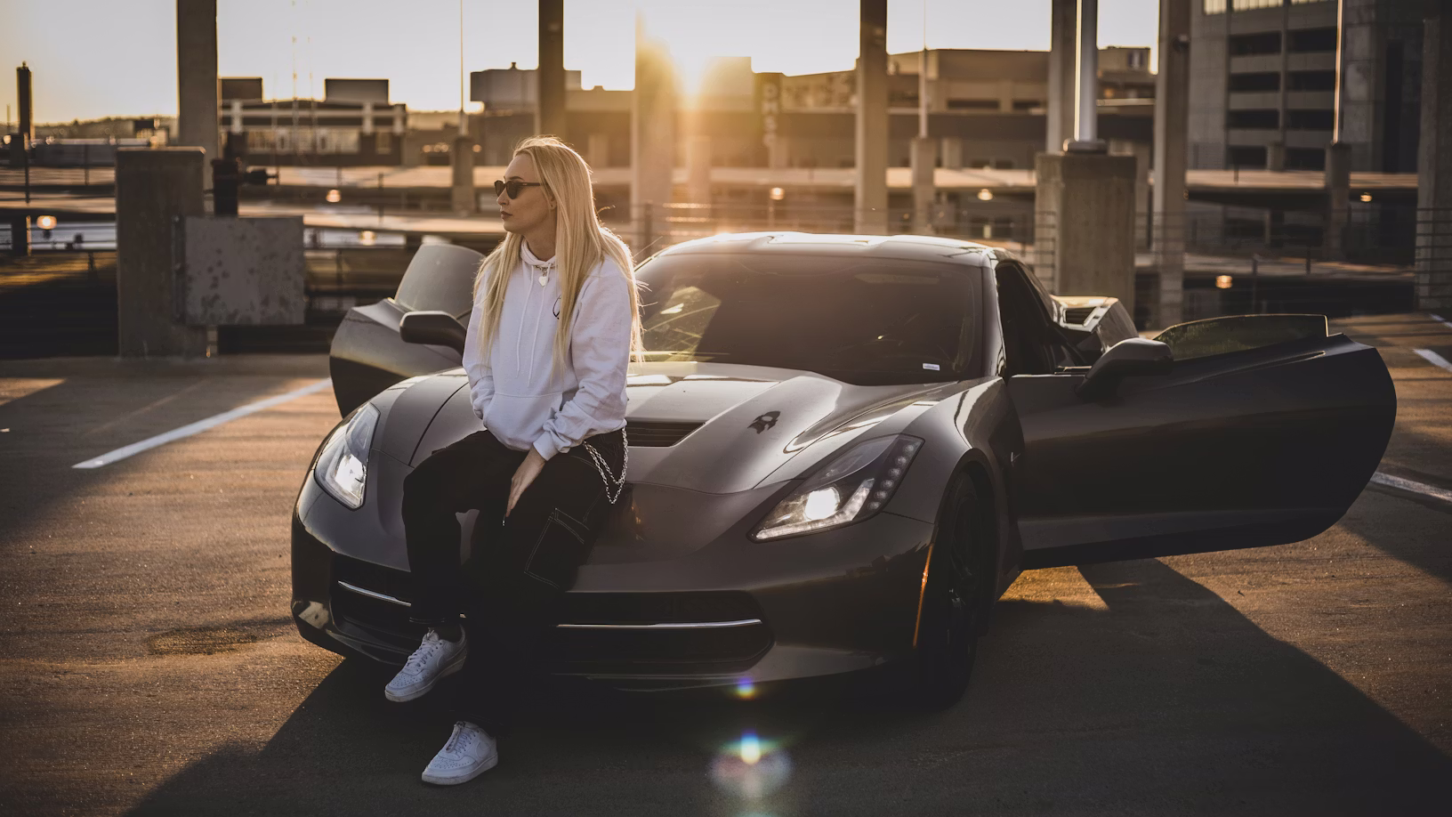 Black Lamborghini Revuelto in a stone showroom, exotic car rental in Southern California